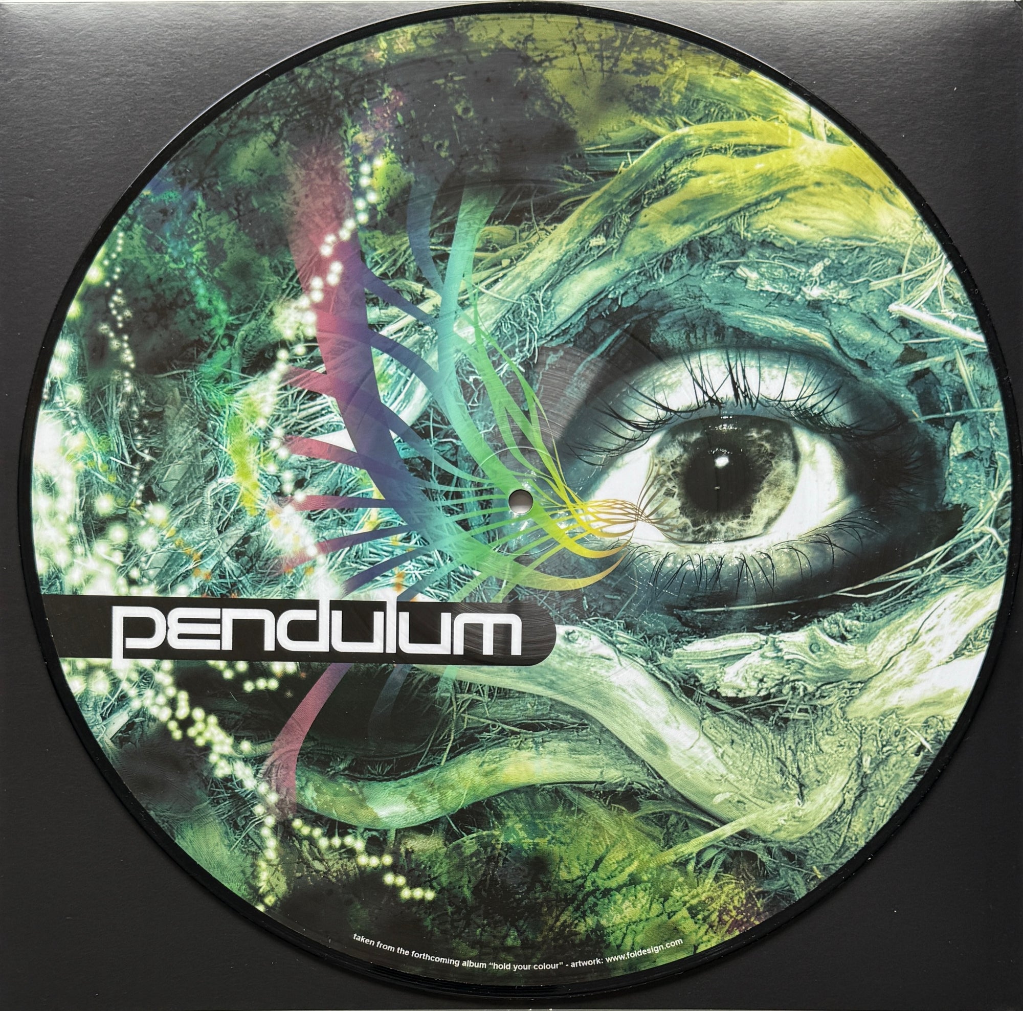 Vinyl record cover with an eye and plant design, featuring the brand 'Pendulum'.